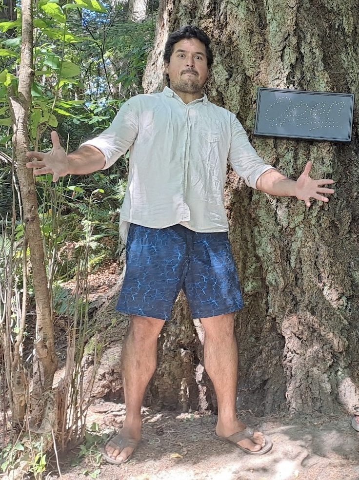 Jorge Pedret standing against a tree in the forest